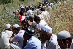 Uzbek men praying at the funeral of 20-year-old Khairullo Amanbaev. Amanbaev died of the injuries he suffered while in the custody of the Osh city police. &copy; 2010 Human Rights Watch