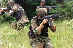 Paramilitary gunmen in Colombia; via flickr