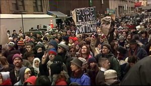 Antiwar demonstrators protest against the looming Iraq War in New York, February 15, 2003. (Still from Amir Amirani’s “We Are Many,” used with permission.)