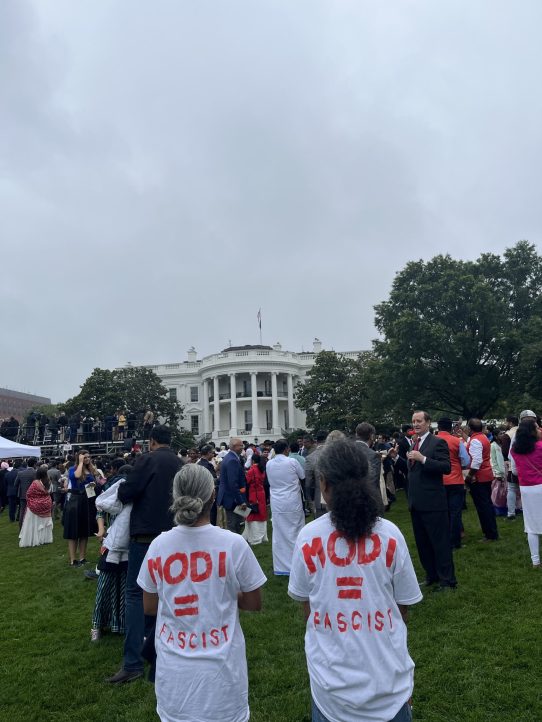 Basav Sen (right) and a fellow protestor wear shirts emblazoned with the words "Modi = Fascist" at the White House garden reception for Indian Prime Minister Narendra Modi. (Photo by Apoorva)